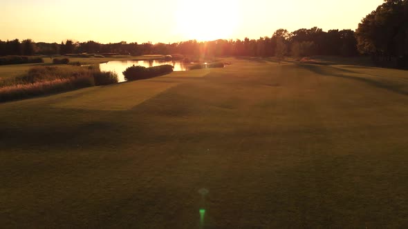 Grass Field for Golf and Still Pond