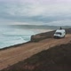Landscape of wild ocean coast with waves and a van shot by drone - VideoHive Item for Sale