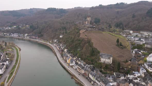 drone flight towards the castle of cochem over  the river Moselle with a view over this incredibly b