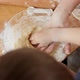 Closeup of Little Boy with Mother Kneading Biscuit Dough in Big Glass Bowl - VideoHive Item for Sale