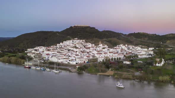 Drone Hyperlapse moving timelapse of Sanlucar de Guadiana in Spain, from Alcoutim in Portugal