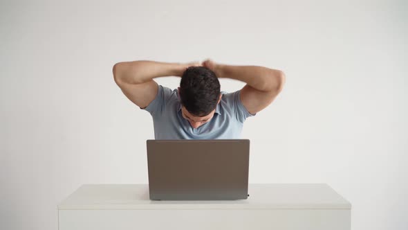 Happy Office Worker Works at Laptop and Funny Rejoices at Successful Deal