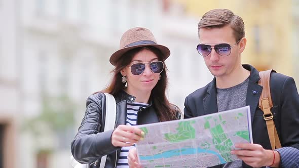 Happy Tourist Couple Traveling on Holidays in Europe Smiling Happy. Caucasian Couple