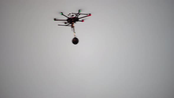 Silhouette of Professional Photography Drone Copter with the Panoramic Camera Rig Flying in the Sky