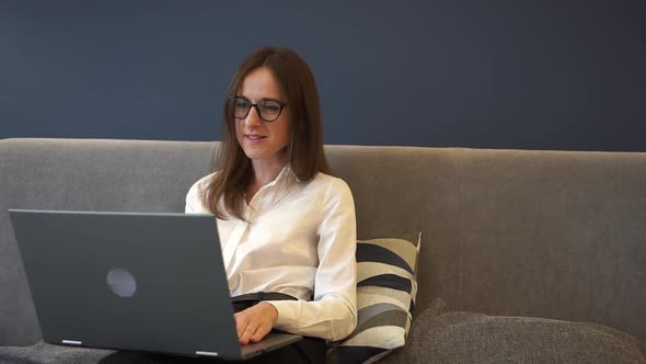 Young Businesswoman Customer Service Manager Speaking to Webcam Communicating in Distance Remote