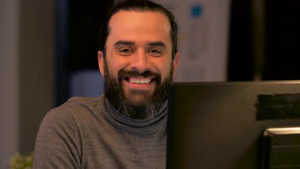 Portrait of Man with Computer at Night Office