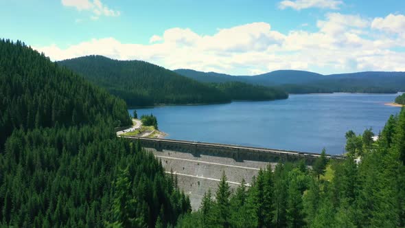 Aerial View Over a Dam in The Mountains