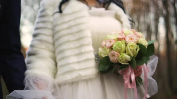 Bride and Groom Walking in the Park