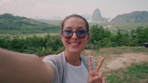 Beautiful Young Woman Doing Selfie on the View Point