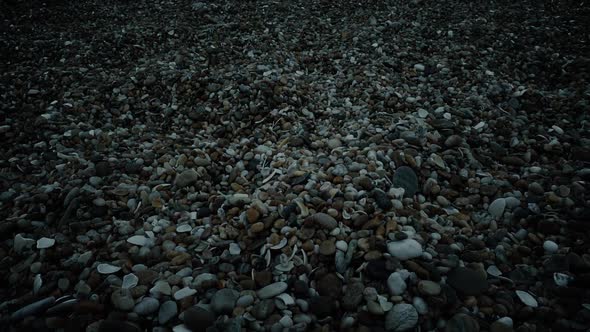 Moving Over Beach Pebbles At Night