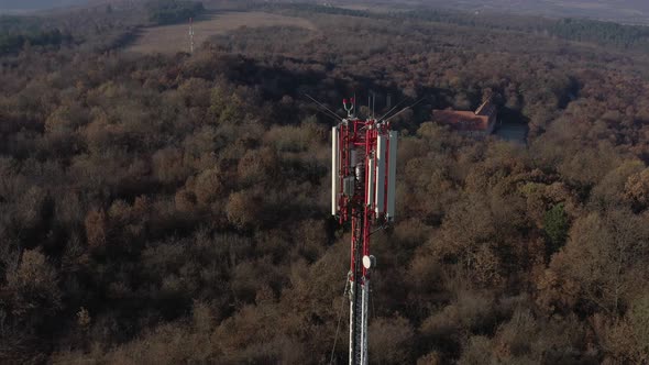 Flying above construction of telecommunication tower  4K aerial video