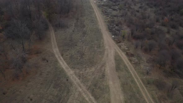 Descending on mud roads intersection aerial drone 4K video