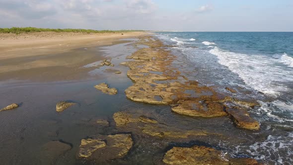 Shallow Rocky Reef Between the Sea and the Beach