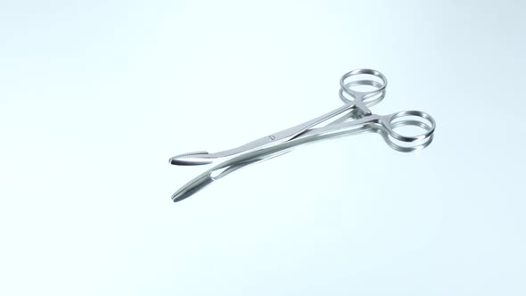 Surgical Clamps, on White, Reflection, Rotation