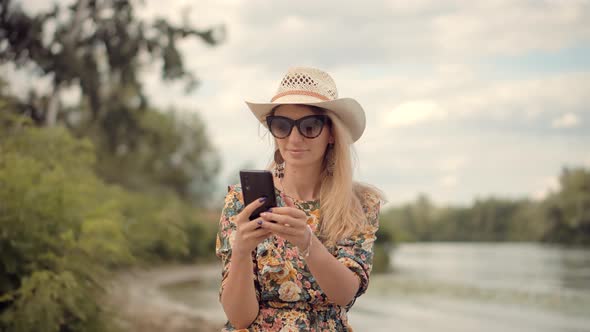 Girl Talking On Cellphone Or Smartphone. Attractive Woman In Sunglasses Using Mobile Phone And Call.