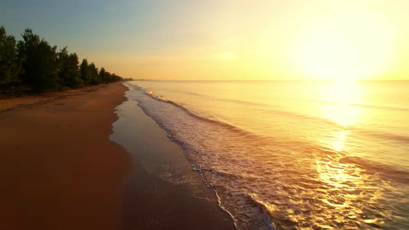 Drones fly over beautiful beaches during sunrise