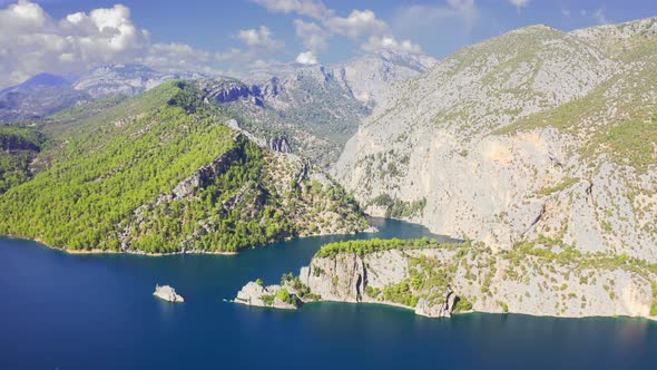 Aerial View on a Lake Among Mountain Cliffs in the Area of the Oymapinar Dam. Landscape of Green