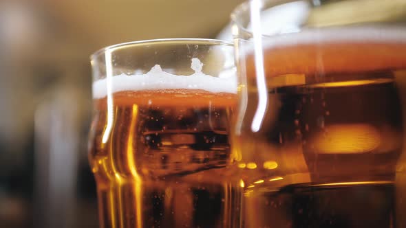 Foamy Beer in Glasses Closeup