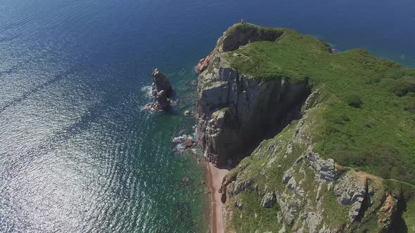 View From a Drone of the Coastline with a Rocky Coast Island of Shkot