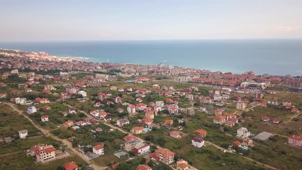 Aerial view of Sunny Beach city that is located on Black Sea shore. Top view of sand beaches