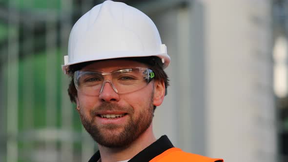 Portrait of smiling engineer wearing helmet