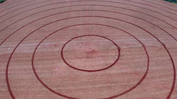 Aierial shot of a harvested circular crop field  in Brazil