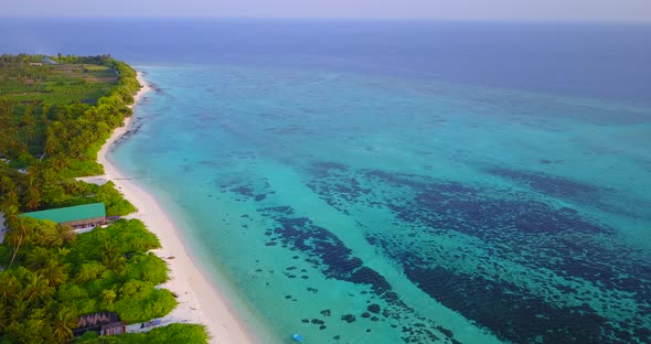 Luxury birds eye copy space shot of a sunshine white sandy paradise beach and blue water background 