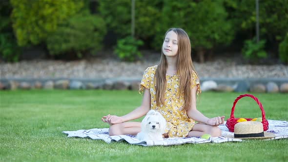 Little Girl in Yoga Position in the Park.