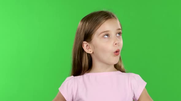 Child Looks with Great Surprise Around. Green Screen