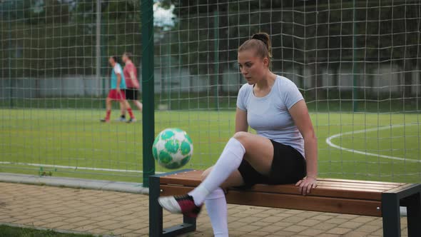 Portrait of Woman Football Player in the Park