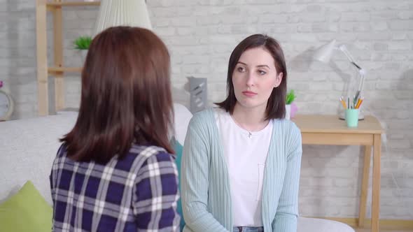 Closeup Face Beautiful Deaf Young Women Talking With Sign Language in the Living Room at Home