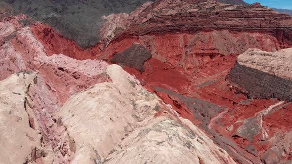 Flying By Red Mountains Near Salta, Argentina. Aerial Shot, 