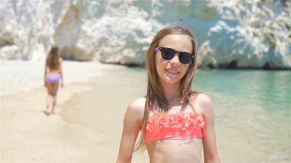 Little Girls Having Fun at Tropical Beach During Summer Vacation