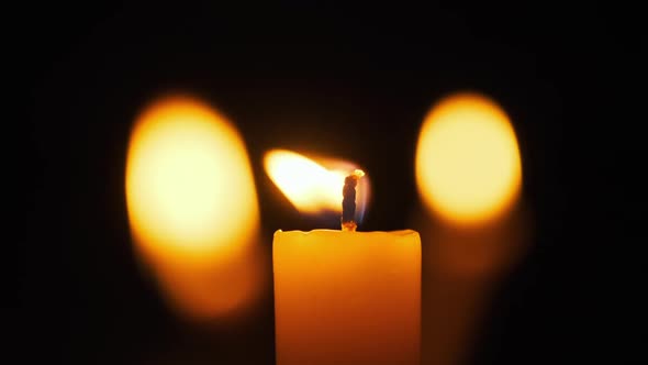 Candles Flame on Black Background