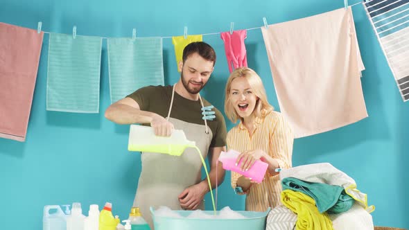 Laughing Couple Gets Pleasure From Cleaning Process