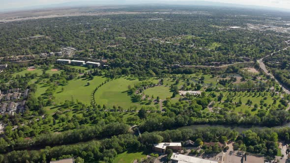 Drone shot of the lush Ann Morrison Park along the Boise River in Idaho.