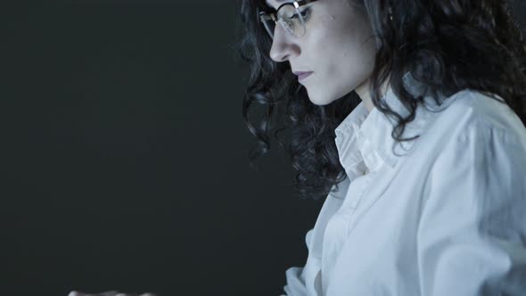 Serious Young Businesswoman Using Laptop