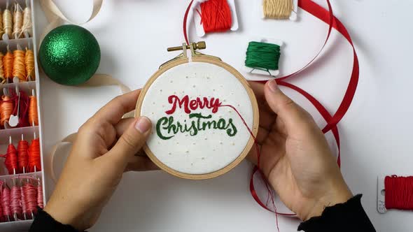 Merry Christmas wooden hoop embroidery as decoration for home or Christmas tree. Crafts, Holidays.