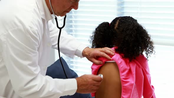 Male doctor examining a patient