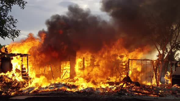 House on fire burning in slow motion