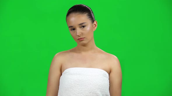 Woman Very Upset and Looking at the Camera on Green Screen at Studio
