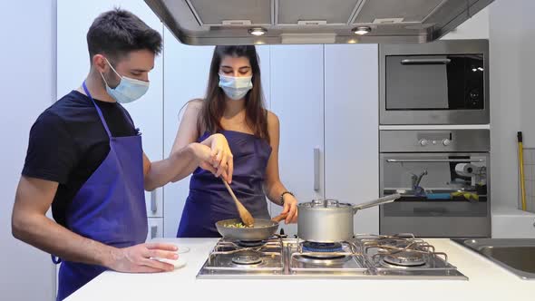 Social distance, girl and man in medical masks to protect themselves from virus and infection during