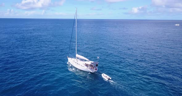 Beautiful aerial clean view of a white sandy paradise beach and aqua blue ocean background in hi res