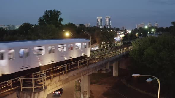 City Skyline with Subway Train passing by alt