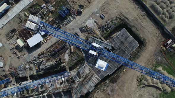 Construction Crane and Standing Building Top View