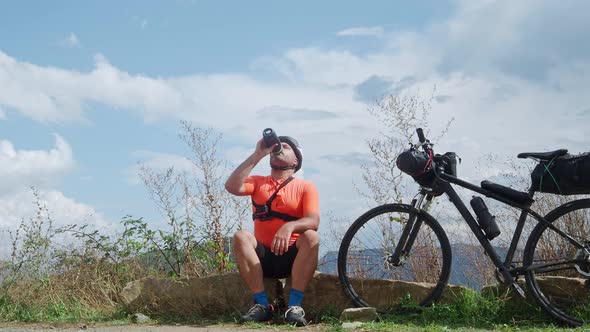 Cyclist Man Resting Drinking Water