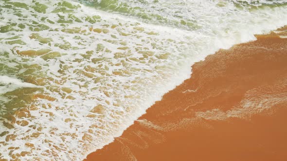 Waves Breaking at Sandy Beach, Aerial Drone View of Sea Lapping Shore and Golden Sand in Tropical Is