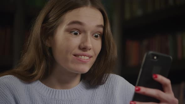 Young Adult Caucasian Woman Waving Her Hand in a Good Bye on Video Call with Friends on Smart Phone