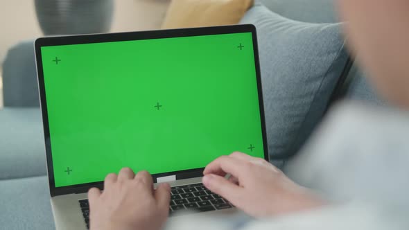 Freelance Male Chatting Over The Internet On Social Networks With Green Screen