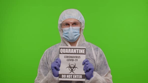 Doctor in Suit Showing Warning Text Slogan on Paper  Quarantine Covid19 Coronavirus Do Not Enter